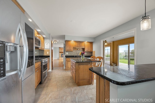 2288 Westminster St, Wheaton, IL 60189 - kitchen featuring hanging light fixtures, appliances with stainless steel finishes, a sink, a center island, and backsplash