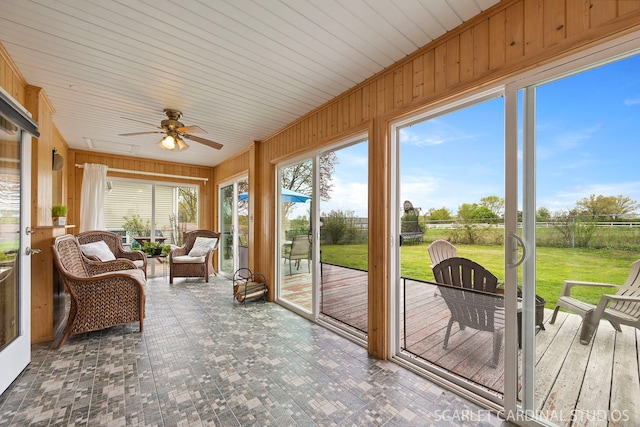 2288 Westminster St, Wheaton, IL 60189 - sunroom featuring ceiling fan, wood walls, a wooden deck, and an outdoor hangout area