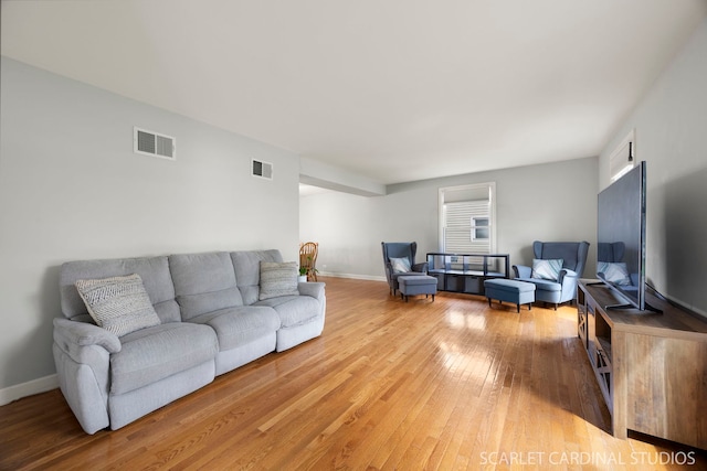 2288 Westminster St, Wheaton, IL 60189 - living area featuring baseboards, light wood finished floors, and visible vents