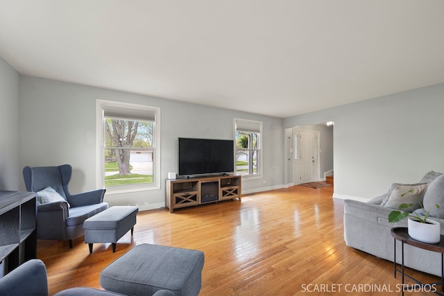 2288 Westminster St, Wheaton, IL 60189 - living area featuring baseboards, a healthy amount of sunlight, and light wood-style floors