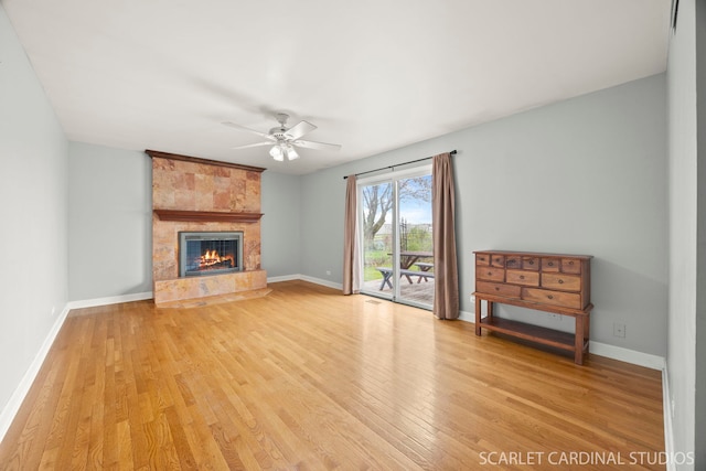 2288 Westminster St, Wheaton, IL 60189 - unfurnished living room featuring baseboards, light wood finished floors, ceiling fan, and a fireplace