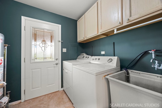 2288 Westminster St, Wheaton, IL 60189 - laundry area with independent washer and dryer, cabinet space, a sink, baseboards, and light tile patterned flooring