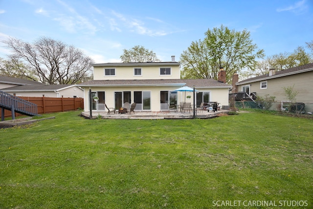 2288 Westminster St, Wheaton, IL 60189 - rear view of property with a lawn, a patio, and fence