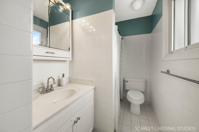 2288 Westminster St, Wheaton, IL 60189 - bathroom featuring vanity, tile patterned floors, toilet, and tile walls