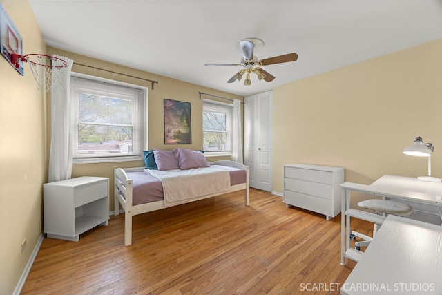 2288 Westminster St, Wheaton, IL 60189 - bedroom with baseboards, ceiling fan, light wood finished floors, and a closet