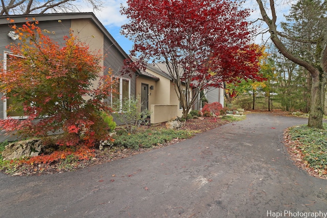 view of property exterior with driveway
