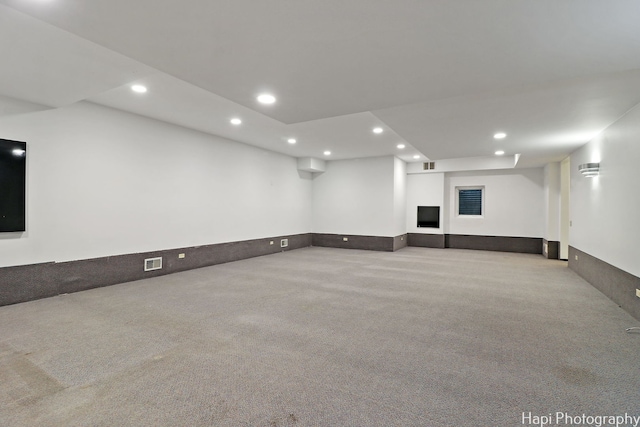 interior space featuring visible vents, recessed lighting, and carpet flooring