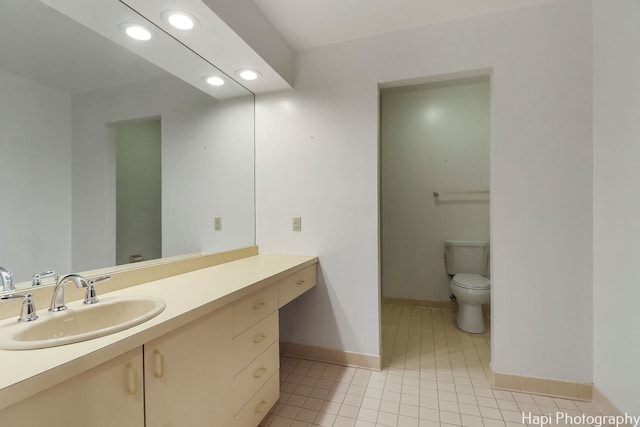 bathroom featuring baseboards, toilet, recessed lighting, vanity, and tile patterned flooring