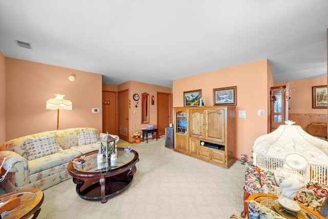 living room with light carpet and visible vents