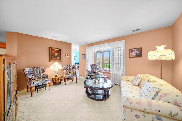 carpeted living area featuring visible vents