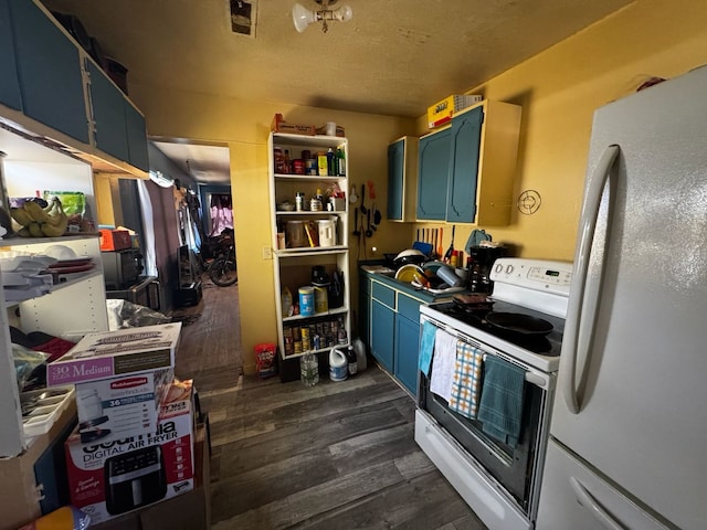 kitchen featuring dark wood-type flooring, blue cabinets, and white appliances