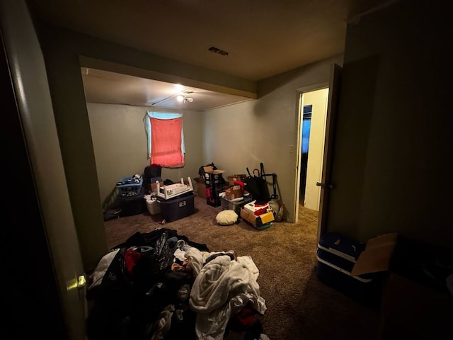 carpeted bedroom featuring visible vents