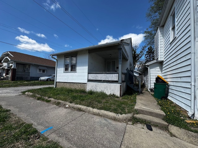 view of property exterior with covered porch