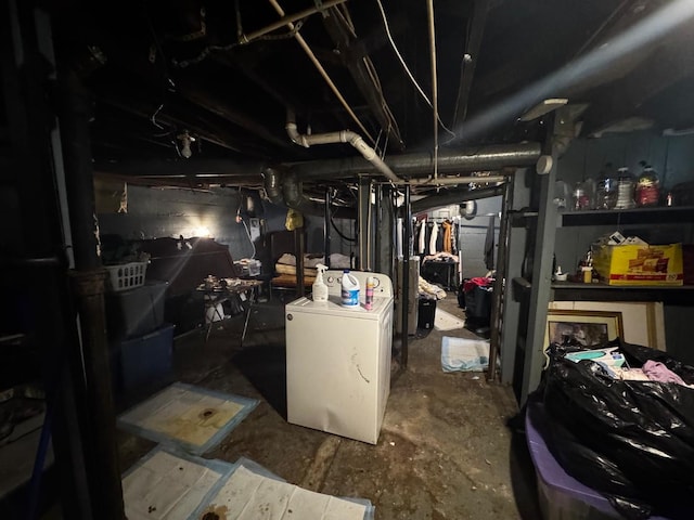 unfinished below grade area with washer / clothes dryer