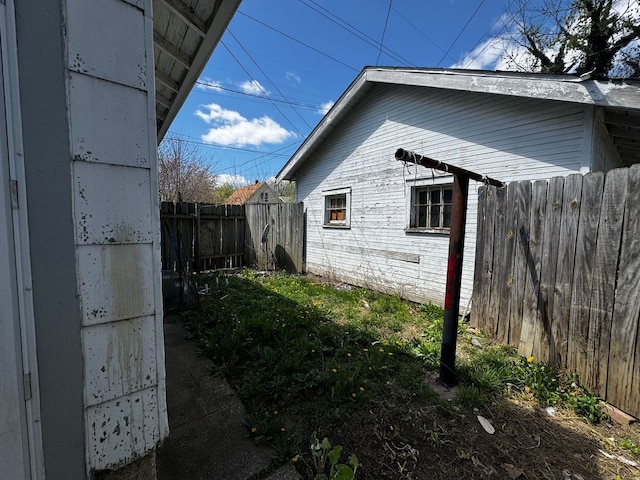 view of side of property with fence