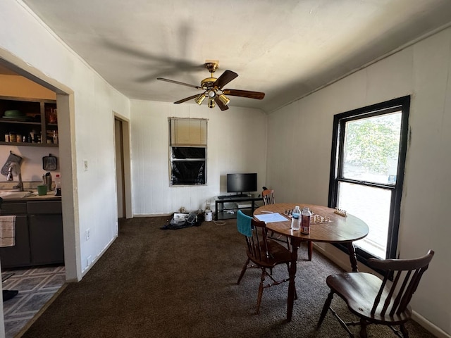 dining area featuring carpet flooring and ceiling fan