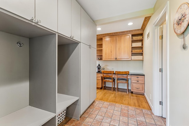 1135 Buttonwood Ln, Northbrook, IL 60062 - mudroom with built in desk, stone finish floor, visible vents, and recessed lighting