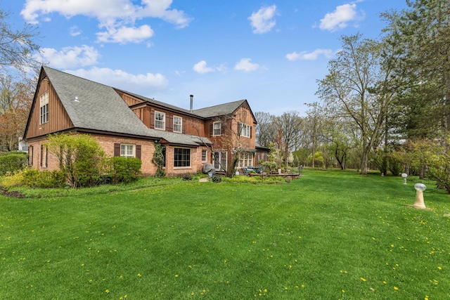 1135 Buttonwood Ln, Northbrook, IL 60062 - back of property with a lawn, brick siding, and a shingled roof