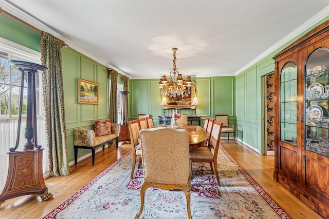 1135 Buttonwood Ln, Northbrook, IL 60062 - dining space featuring a decorative wall, light wood-type flooring, and a chandelier