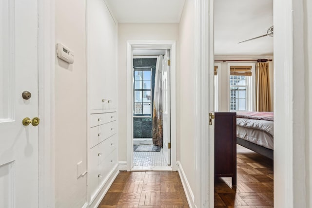 corridor featuring baseboards