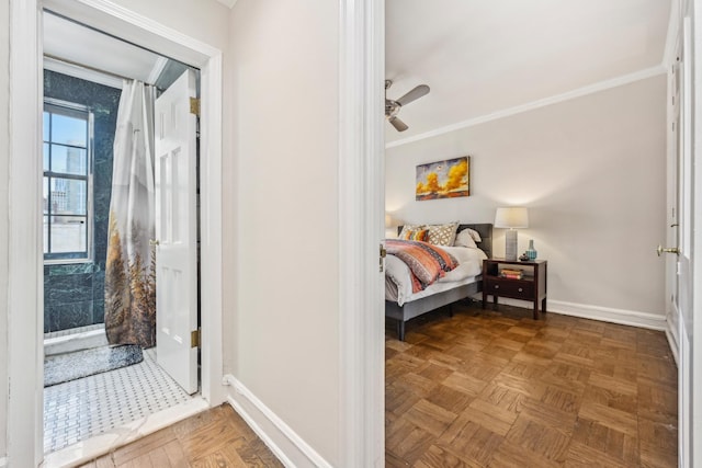 bedroom featuring baseboards, crown molding, and a ceiling fan