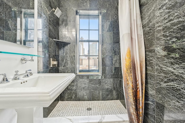 bathroom with tiled shower