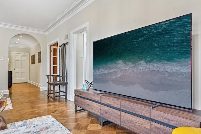 interior space featuring visible vents, baseboards, ornamental molding, and arched walkways