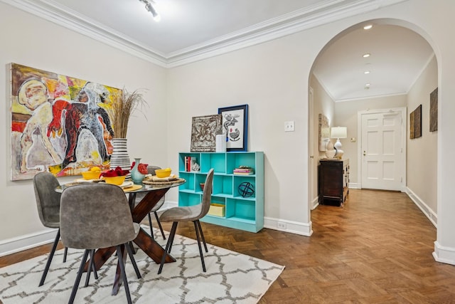 dining area featuring ornamental molding, baseboards, arched walkways, and recessed lighting