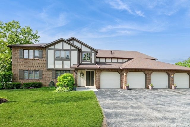 7834 W Foresthill Ct Unit 1Cr, Palos Heights, IL 60463 - tudor house featuring a front lawn, brick siding, asphalt driveway, and a shingled roof