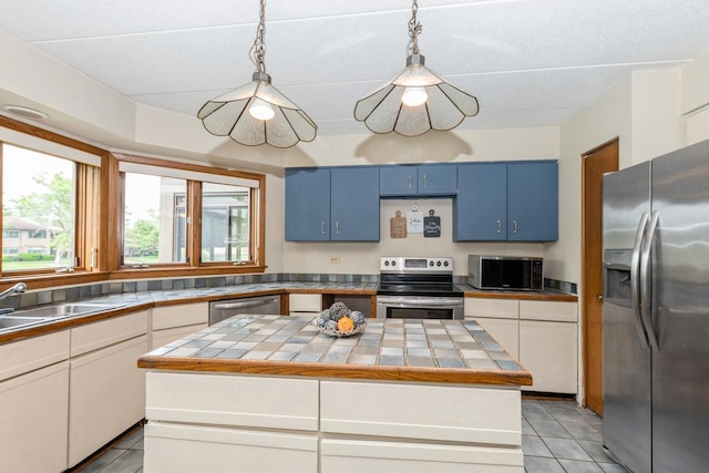 7834 W Foresthill Ct Unit 1Cr, Palos Heights, IL 60463 - kitchen with appliances with stainless steel finishes, blue cabinetry, light tile patterned flooring, and a sink