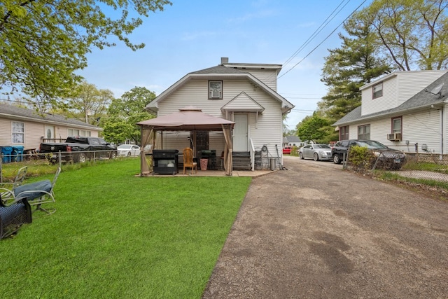 135 N Calhoun St, Aurora, IL 60505 - back of house featuring a gazebo and a chimney