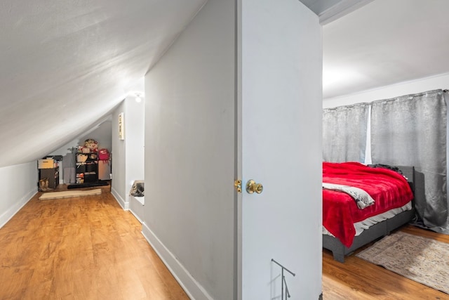 135 N Calhoun St, Aurora, IL 60505 - bedroom featuring wood finished floors, vaulted ceiling, and baseboards