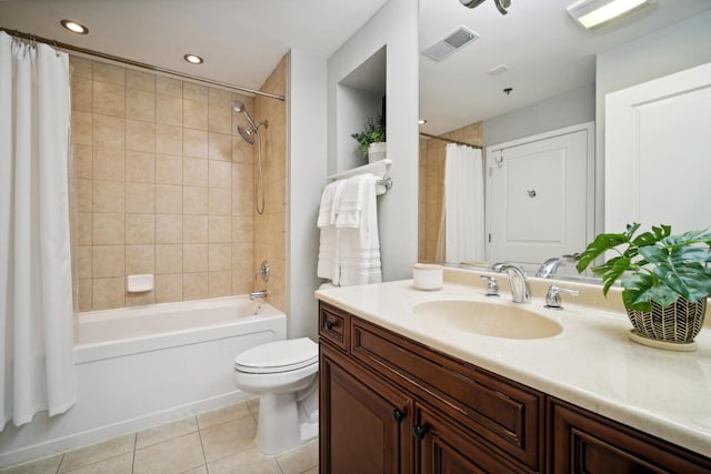 bathroom featuring shower / bath combo, tile patterned flooring, vanity, toilet, and visible vents
