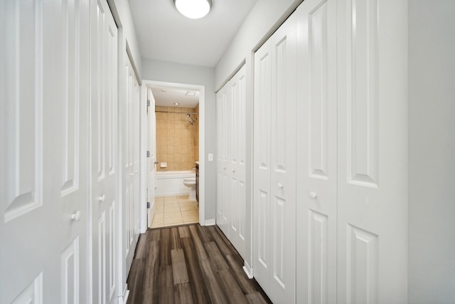 hallway featuring dark wood-style floors