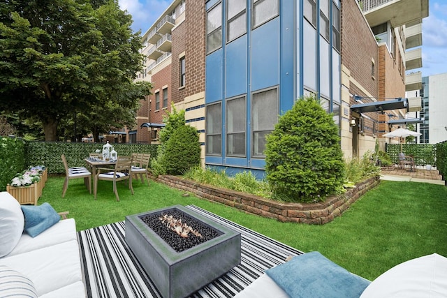 exterior space featuring fence and an outdoor fire pit