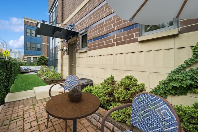 view of patio / terrace featuring fence and outdoor lounge area