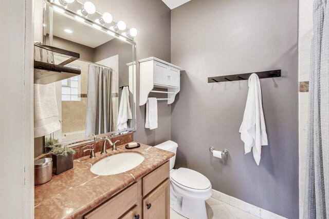 bathroom featuring vanity, tile patterned floors, toilet, and a shower with shower curtain