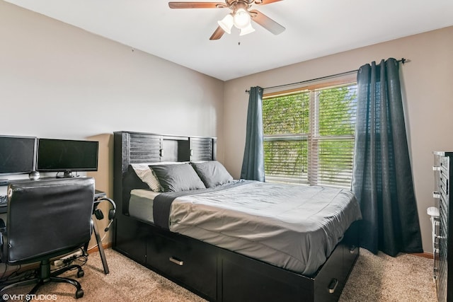 bedroom featuring ceiling fan and light carpet