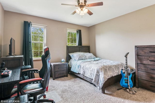 carpeted bedroom featuring a ceiling fan
