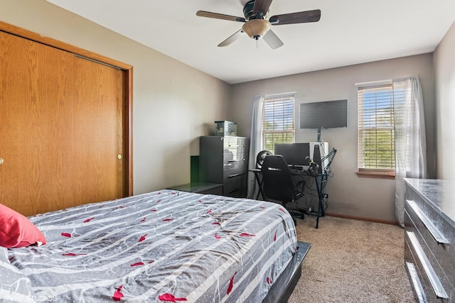 bedroom featuring baseboards, ceiling fan, and carpet