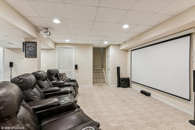 carpeted cinema room featuring recessed lighting, a paneled ceiling, and baseboards