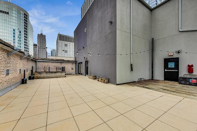 view of patio / terrace featuring a city view