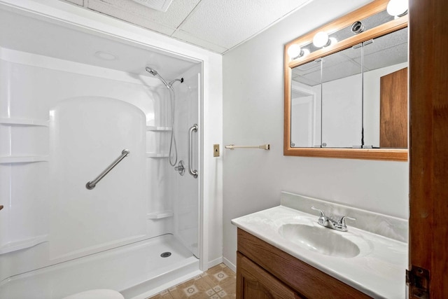 full bathroom featuring vanity, tile patterned floors, and a shower