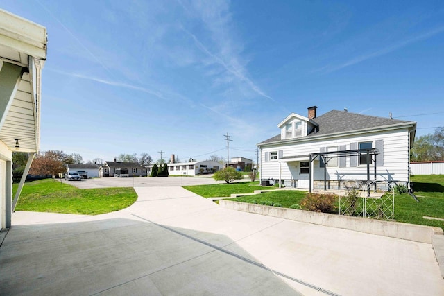 exterior space featuring concrete driveway