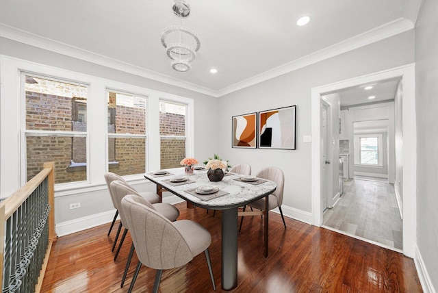 8045 S Escanaba Ave, Chicago, IL 60617 - dining area with baseboards, ornamental molding, and wood finished floors