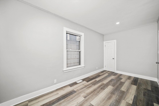8045 S Escanaba Ave, Chicago, IL 60617 - empty room featuring baseboards, wood finished floors, and recessed lighting