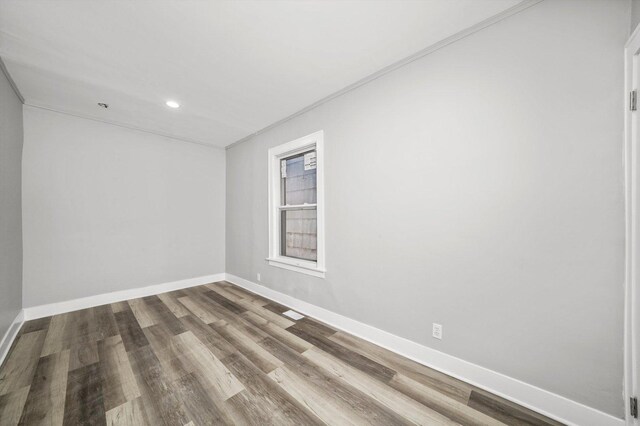 8045 S Escanaba Ave, Chicago, IL 60617 - spare room with baseboards, wood finished floors, and recessed lighting