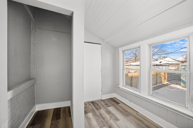 8045 S Escanaba Ave, Chicago, IL 60617 - interior space featuring vaulted ceiling, a closet, wood finished floors, and baseboards