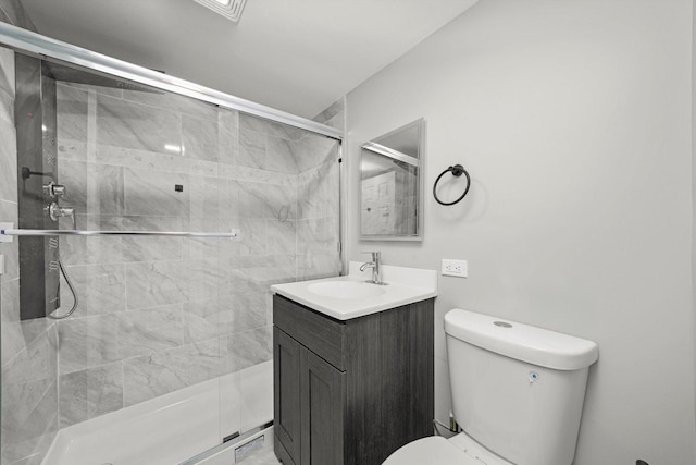 8045 S Escanaba Ave, Chicago, IL 60617 - bathroom with vanity, a shower stall, and toilet