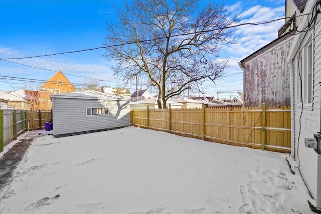 8045 S Escanaba Ave, Chicago, IL 60617 - view of yard featuring a fenced backyard and an outbuilding